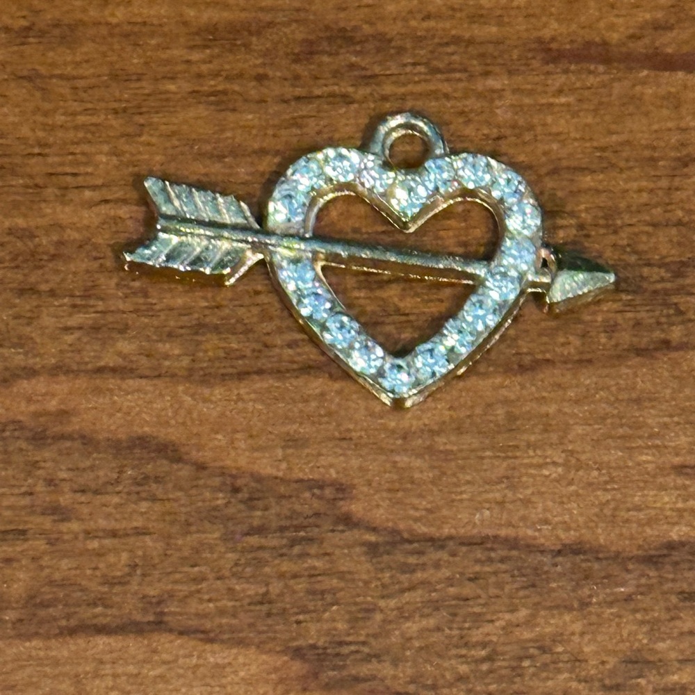 Heart and Arrow Pendant with rhinestones and set in gold tone